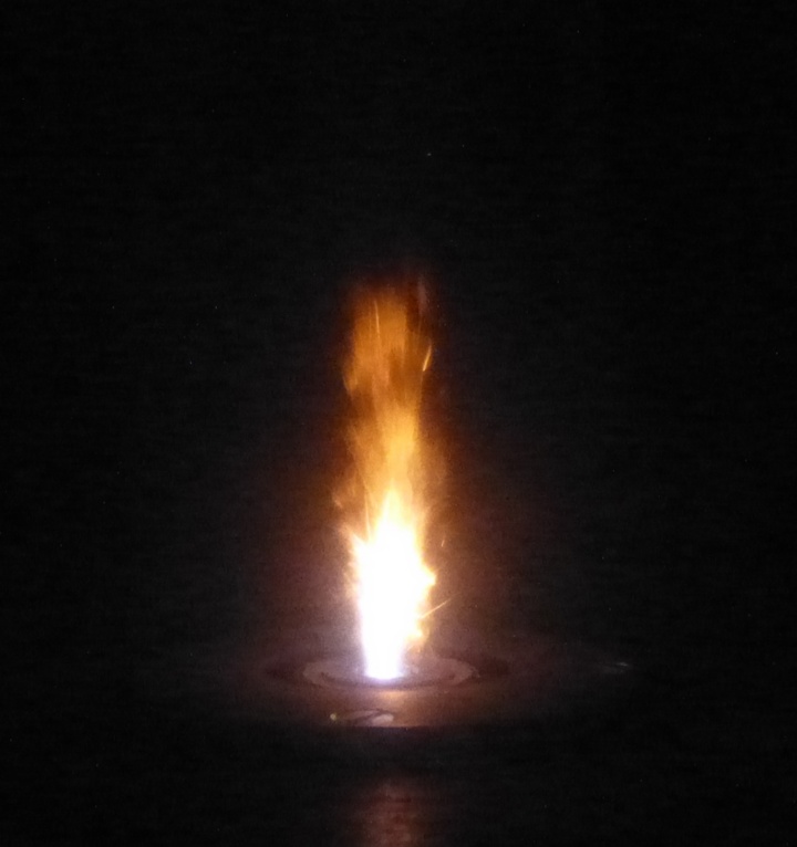 Coal particles ignited by the plasma torch.